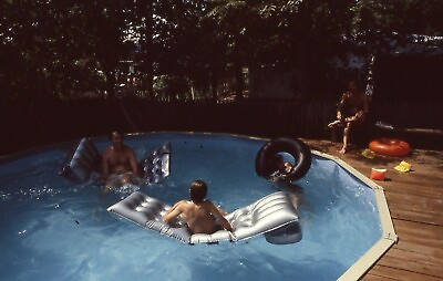 #ad 1981 Slide Swimming Pool Scene Two Men amp; Kids Floats Pool Side